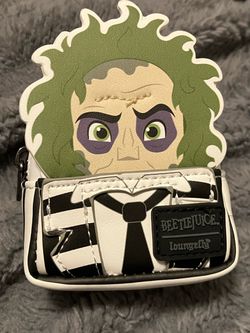 blind-box from the Loungefly Beetlejuice Exclusive Cosplay Mystery Mini Backpack Keychain Charm collection