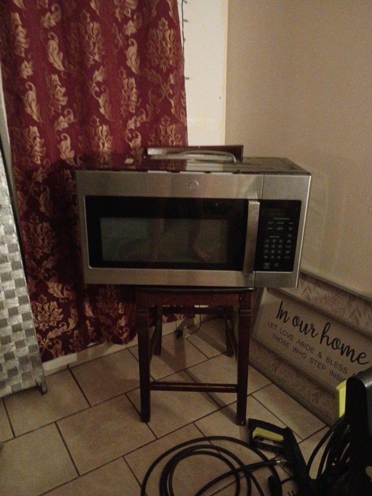 HOME OWNERS BRAND NEW GE Stainless Steel Over The Range Microwave