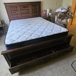 The bed is made of dark brown wood.