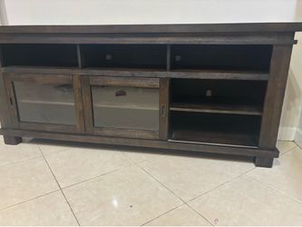Dark wood TV stand / media console with sliding glass doors