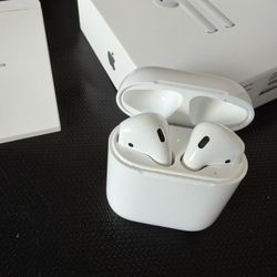 Genuine Apple AirPods 2 + Blue Silicone Case and Original Box and Manuals. Clean, Works Perfectly. Unpaired - Ready for a new user. 