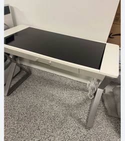 Used - good condition desk with USB, power outlets, and partial glass top