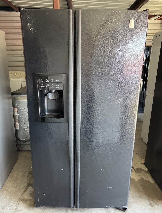 Black GE Refrigerator And Freezer