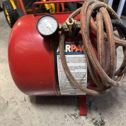 Red AirPac - portable - compressed air tank with gauge and hose.