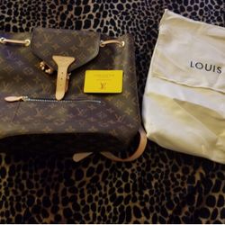 TX0268 Authentic Louis Vuitton XL backpack/purse $500 