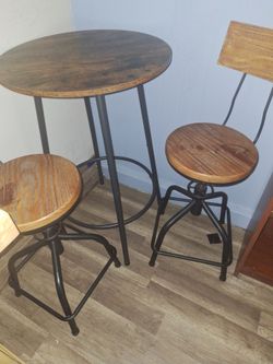 24 inch Bistro table and 2 swivel chairs