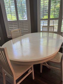 Table (with leaf) and four chairs