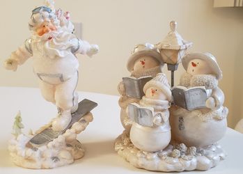 Snowmen and Santa Christmas statues
