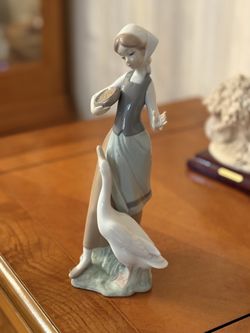 Lladro young maiden and goose