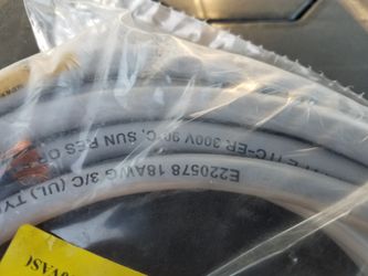 Box full of computer wiring cables and connectors