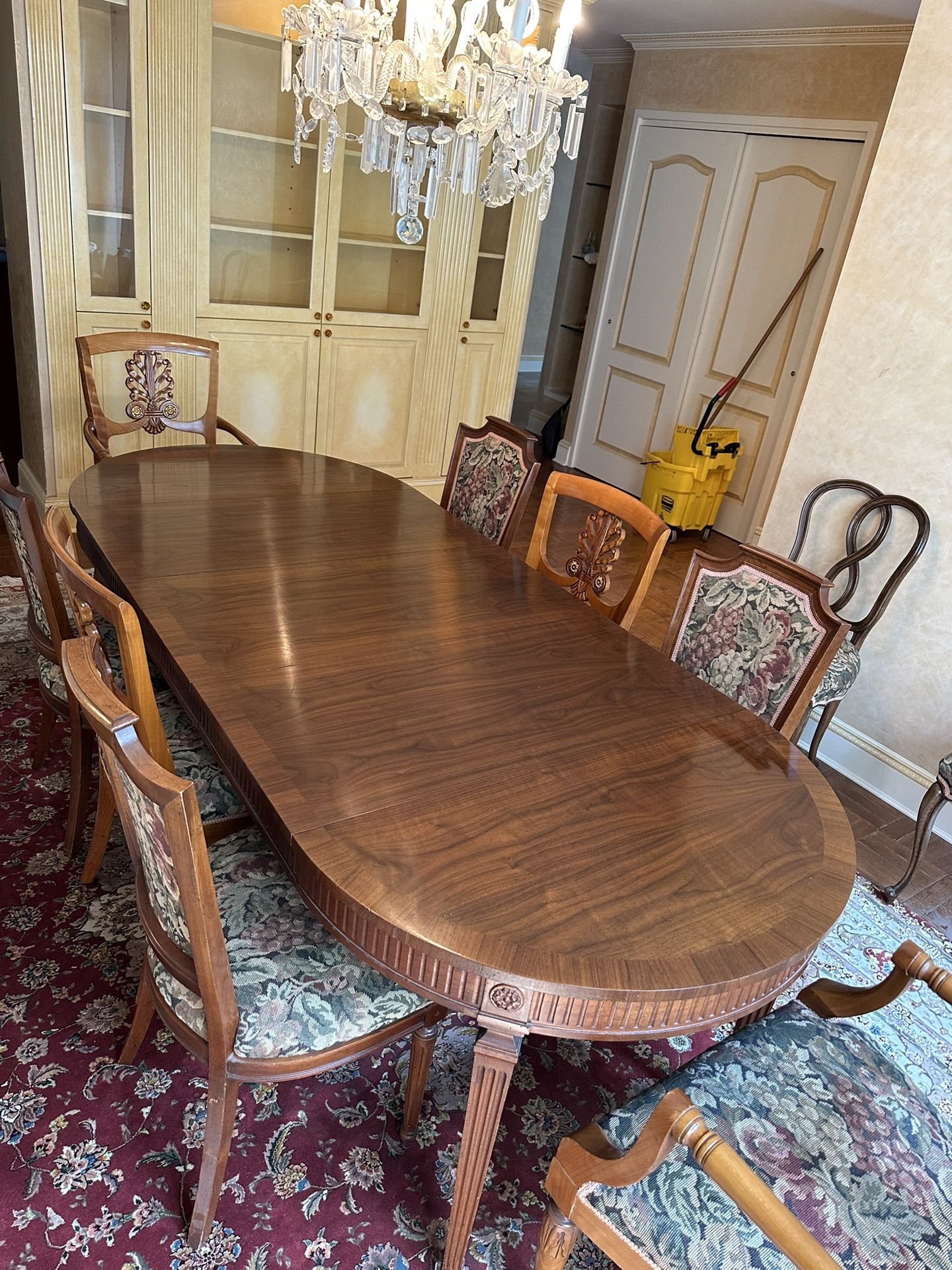 Antique dining room table with 12 chairs