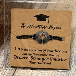 Compass Bracelet with Inspirational Message Black cord bracelet featuring a compass charm. Comes with an inspirational message card.