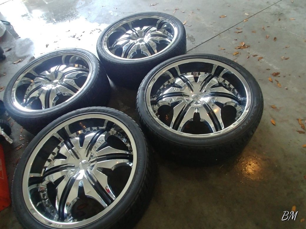 Status 24 inch rims with black inserts.
