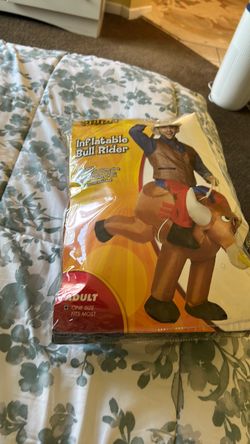 INFLATABLE BULL RIDER I BELIEVE IS NEW GOT TWO DIFFERENT SIZES AND THE OTHER SIZE WAS THE ONE WAS USED