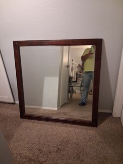 Wood frame with glass mirror $15.firm