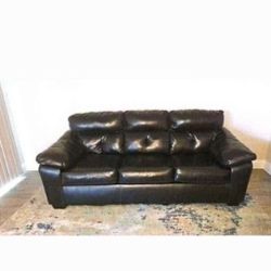BLACK SOFA LEATHER WITH FREE RUG    MOVING SALE 10/26