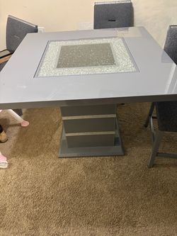 Glass table and two chairs