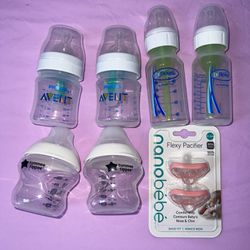 Set of Baby bottles & pacifers 