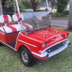 Custom 57 Chevrolet Bell-air Golf Cart body kit in a 48v aluminum frame club car .
