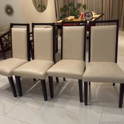 Leather and Wood dinning chairs