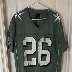 Tilly’s green mesh jersey #26