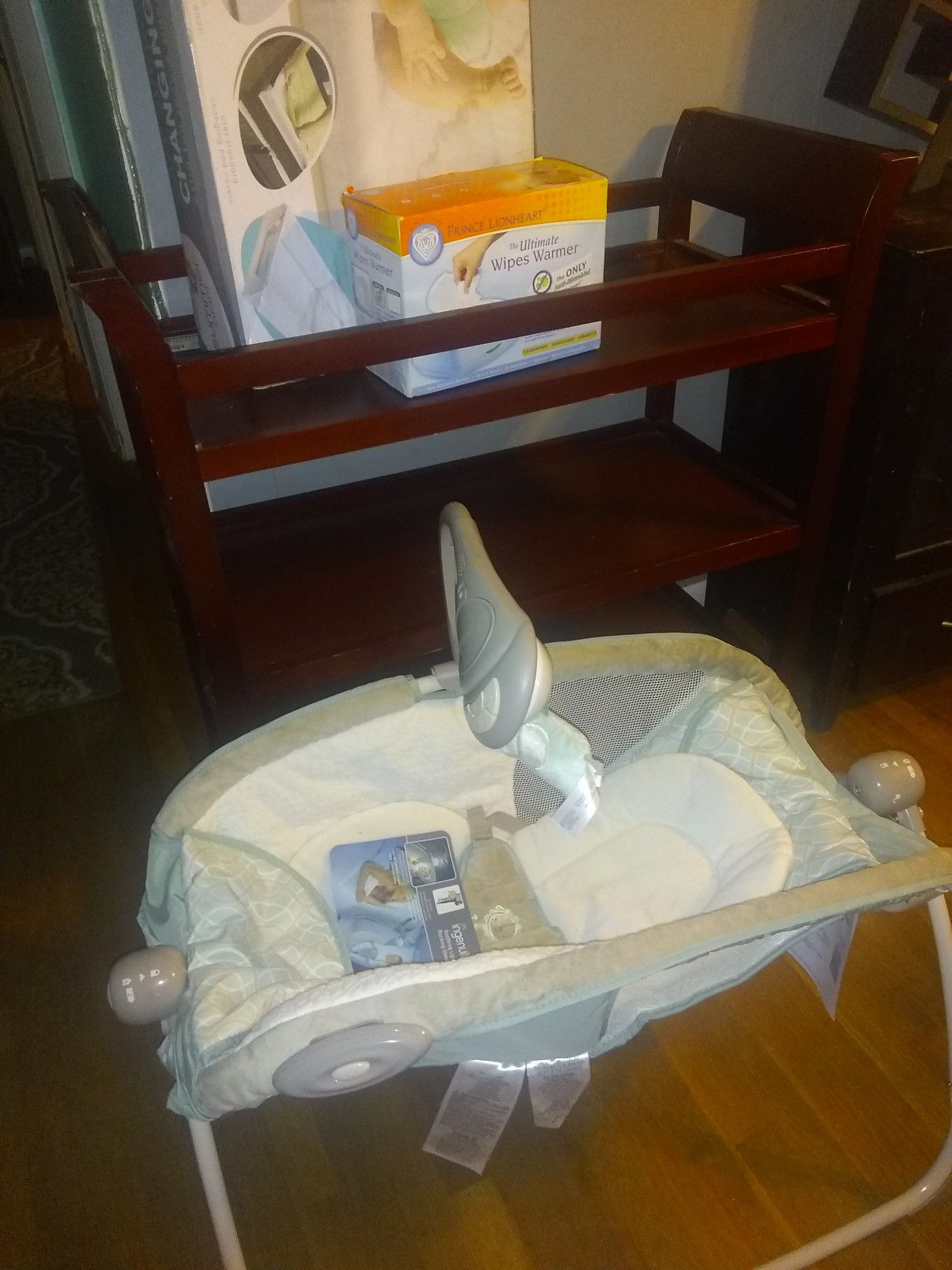 Baby changing table,new baby changing pad,new whipe warmer and new sleeping rocker will deliver for a small fee