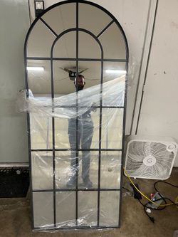 Black arched mirror.