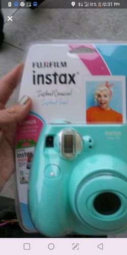 Fujifilm instax. Brand New. Comes with film. Asking 50$obo