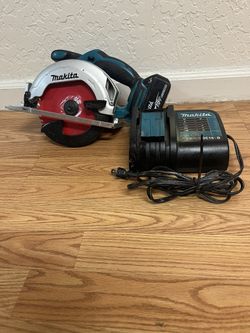 Makita XSS02Z 18V LXT Cordless 6-1/2" Circular Saw, a Makita DC18SD Standard Charger, and a M