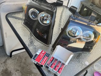 Aftermarket Projector Headlight with Halo Rings plus 8 spark plugs