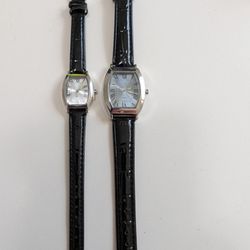 New His and hers stylish watches with black leather straps and silver dials. Both of these watches are new.