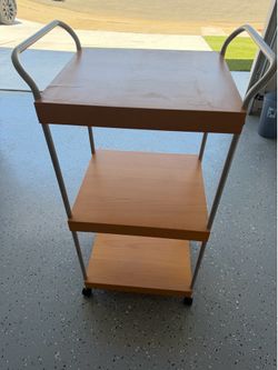 3 shelves table with 4 wheels, rarely used.