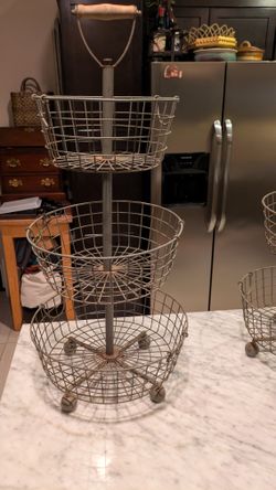 3-Tiered Patina Iron Baskets (2) - wood shovel handle. $10