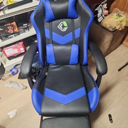 Gaming chair with footrest that reclines to 135 and Lower Back massager