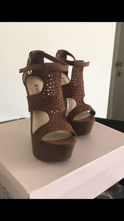 In box, brand new Wedges/ heels/ women shoes size 6.5