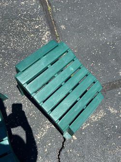 Two Adirondack chair leg rests