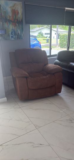 Brown plush suede reclining and swivel extra comfortable recliner chair