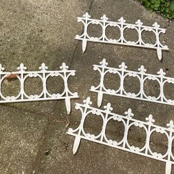 Four pieces of white garden fencing 
