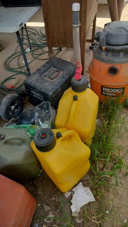 Two racing gas cans they do not leak 75 for both the one needs the hose the other one got a good hose I bought them and never used them what you see i