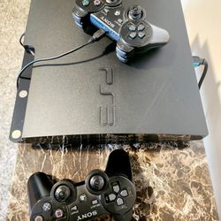 Orginal PS3 With Two Controllers & Games
