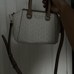 white and brown guess bag 