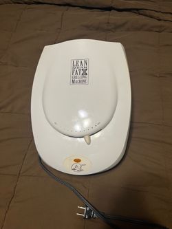 White George Foreman Lean Mean Fat Grilling Machine. It has been tested and works