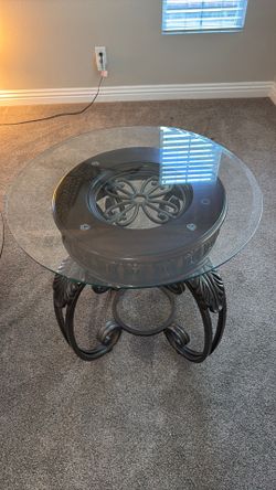 Round coffee table with matching end tables