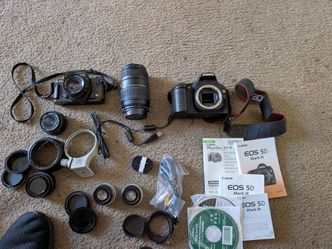 Digital and film cameras plus lenses ((SOLD AS A BUNDLE)) SOLD AS IS