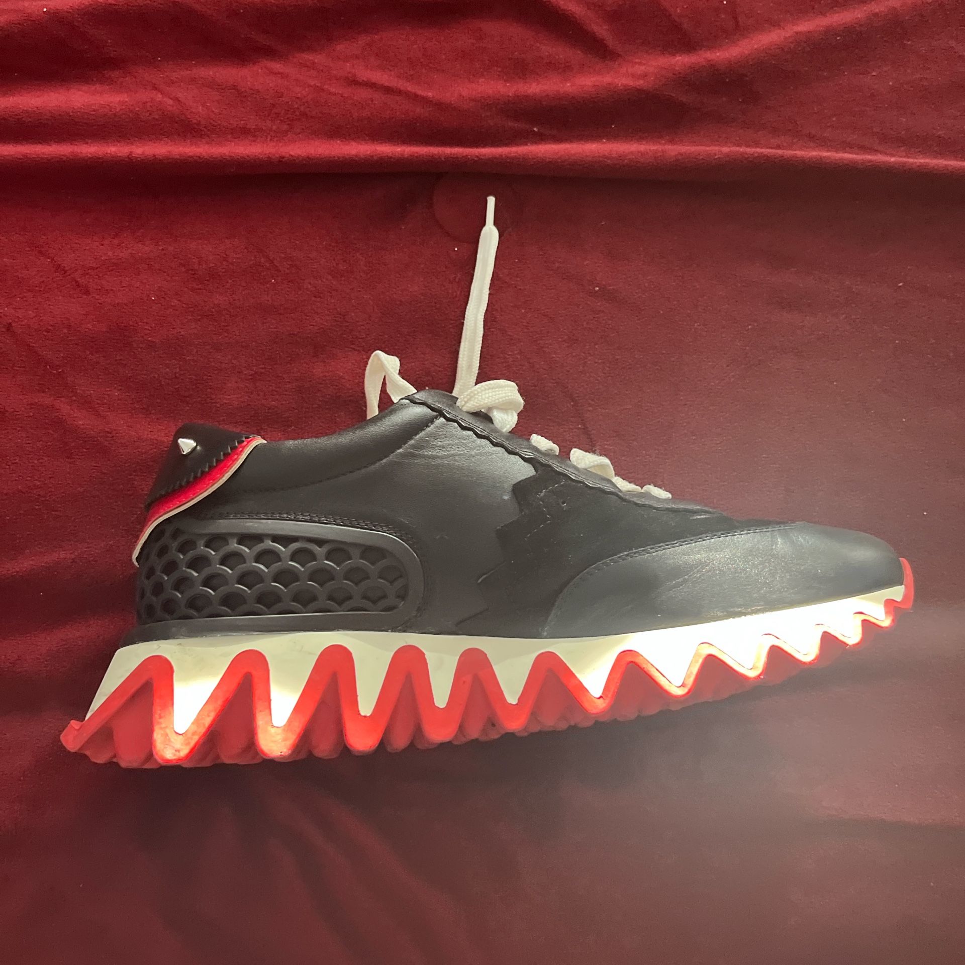 Black and red Christian Louboutin sneakers