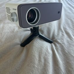 VOPLLS Mini Projector with Tripod Stand - Portable Movie Projector