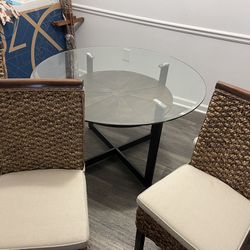 Glass table and four chairs comes with cushions