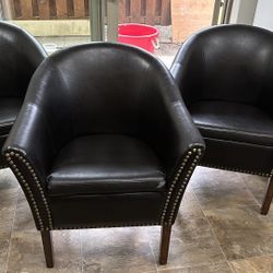 Three Leather Chairs 