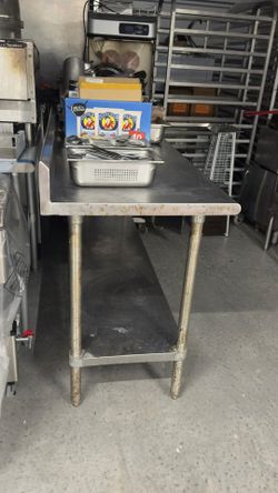 Advance Tabco 24" x 72" 14 Gauge Work Table with Stainless Steel Undershelf and 5" Backsplash   $250 