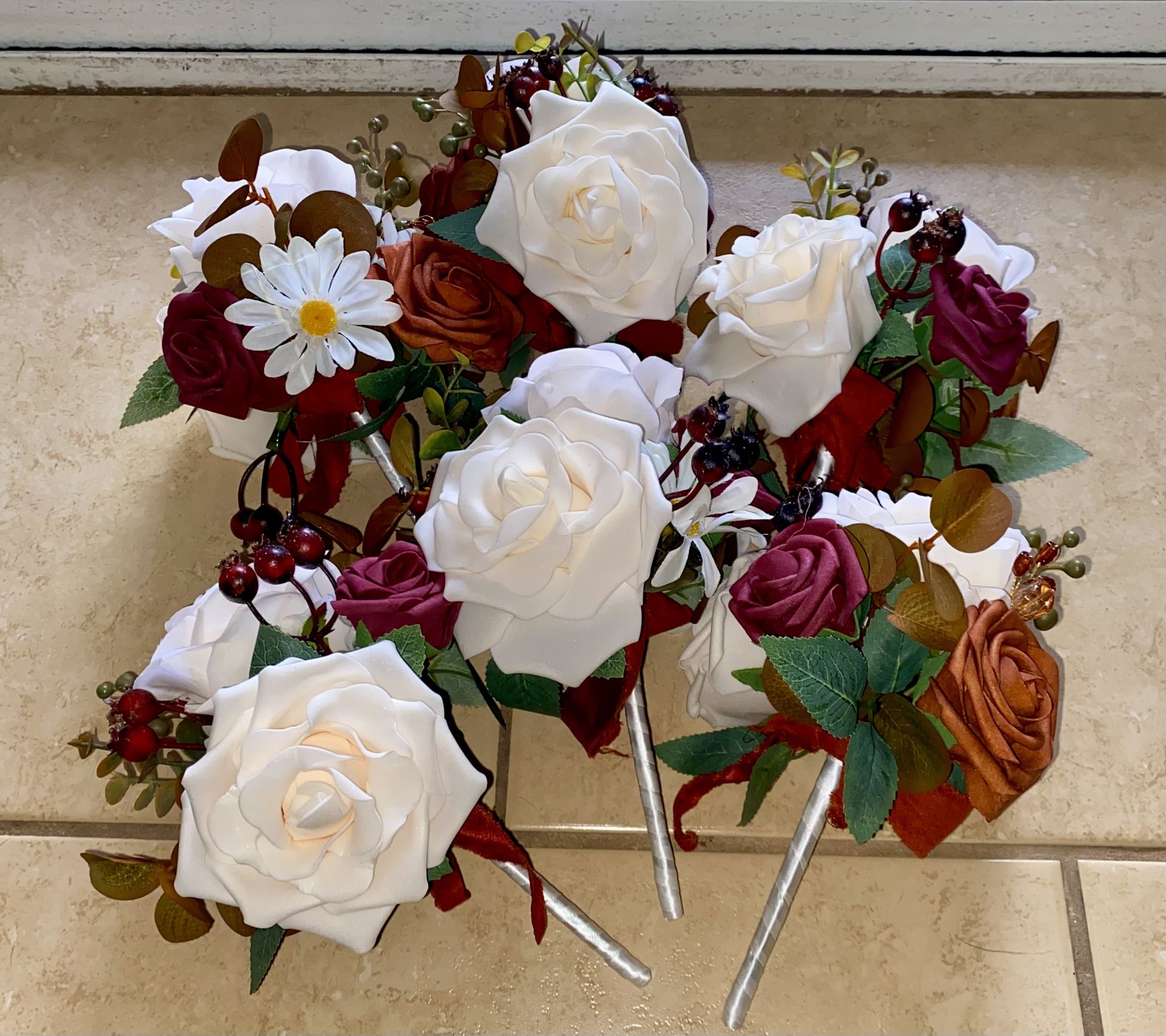 6 small bridesmaid bouquets in sunset terracotta